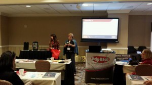 Chris Reed and Kimberly Zelena raffle off prizes at the Help-U-Sell Real Estate Success Summit.